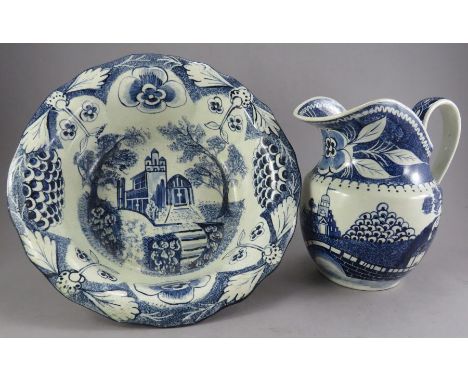 A nineteenth century blue and white hand-painted and sponged jug and bowl, c. 1850. The ewer is decorated with the famous Wil