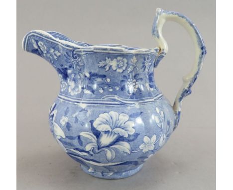 An early nineteenth century blue and white transfer-printed Spode Botanical series lobed jug, c. 1828. It is printed with a b