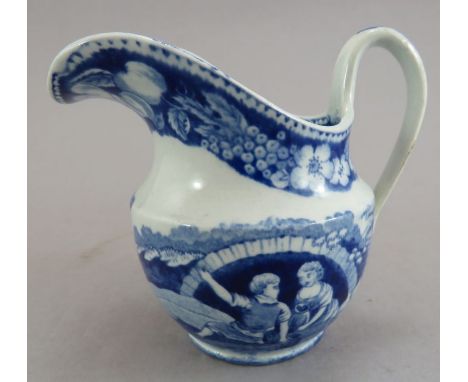 An uncommon early nineteenth century blue and white transfer-printed Spode Blossom pattern helmet-shaped creamer, c. 1825. It