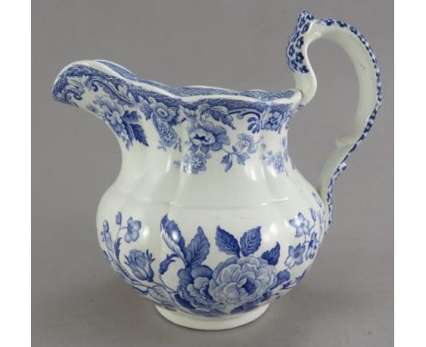 An early nineteenth century blue and white transfer-printed Spode British Flowers series lobed jug, c. 1828. It is marked to 