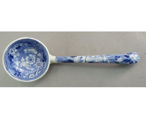 An early nineteenth century blue and white transfer-printed Spode Botanical series sauce ladle, c. 1828. It is marked to the 