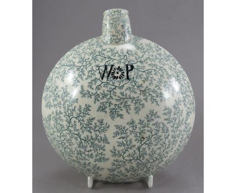 An nineteenth century green and white transfer-printed dedicated pilgrim flask, c. 1830. It is decorated within and all-over 