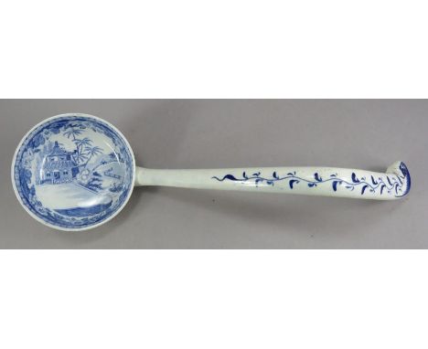 An early nineteenth century blue and white transfer-printed Davenport High Bridge pattern soup ladle, c. 1820 30 cm long. (1)