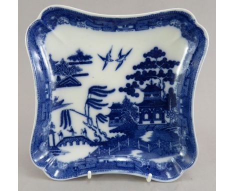 A late eighteenth century blue and white transfer-printed Spode Willow pattern dish, c. 1790. It is marked to the underside. 