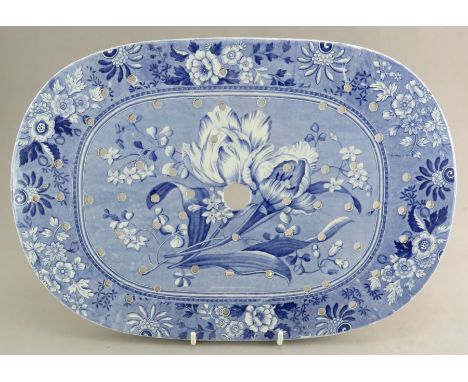 An early nineteenth century blue and white transfer-printed Spode Botanical drainer, c. 1828. It is printed with a botanical 