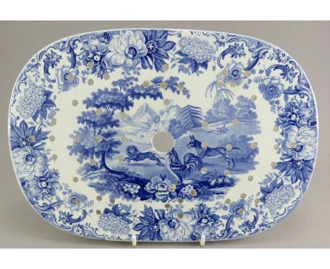 An early nineteenth century blue and white transfer-printed Spode Aesop's Fables series drainer, c. 1828. It is printed with 