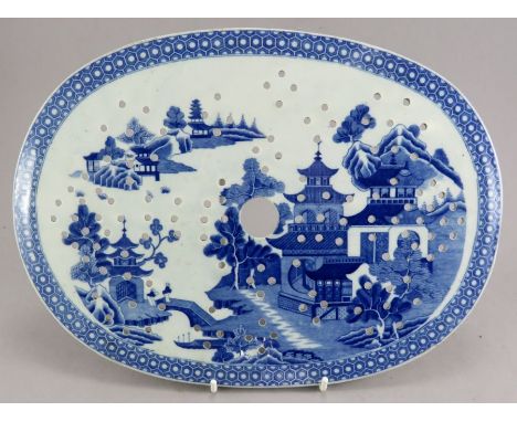 An nineteenth century blue and white transfer-printed drainer, c. 1815. It is decorated with the Queen Charlotte pattern by S