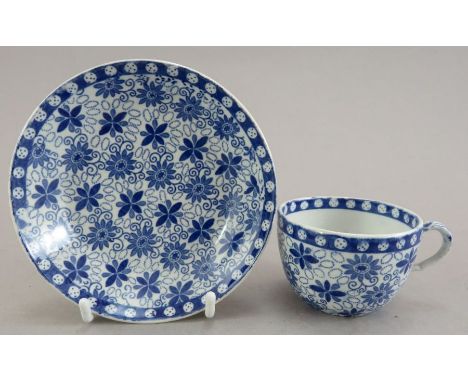 An early nineteenth century blue and white transfer-printed Spode Daisey &amp; Bead pattern miniature cup and saucer, c. 1820