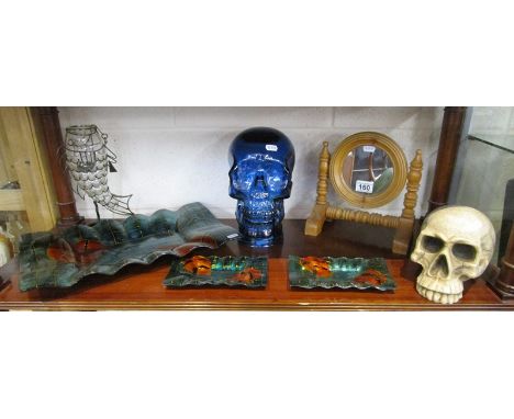 Shelf of collectables to include skulls