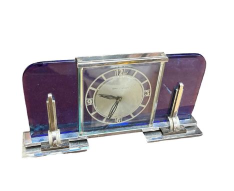 Art Deco Mantel Clock. Garrard - Le Coultre. With blue glass and chrome baseThere is a crack to the glass at the back running