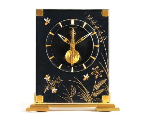 JAEGER-LECOULTRE. A MID 20TH CENTURY MARINA BEE MODEL MANTEL CLOCK the gilt brass and lucite case on a black background decor