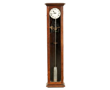 AN EARLY 20TH CENTURY GILLETT & JOHNSTON OAK CASED ELECTRIC MASTERS CLOCK the slim case with glazed door enclosing a 6.5" sil