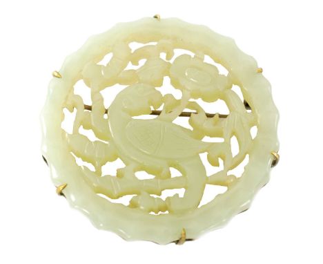 A CHINESE CARVED JADE BROOCH decorated with a pierced bird and floral work border5cm diameter Extra images have been uploaded
