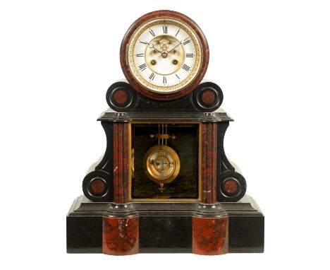 A 19TH CENTURY BLACK SLATE AND ROUGE MARBLE FRENCH MANTEL CLOCK the drum head case with scrolled tapering sides and outset co