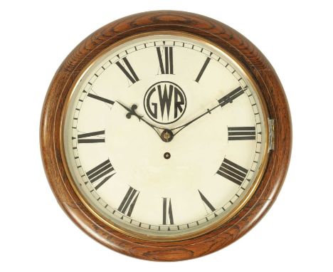 A LATE 19TH CENTURY GWR FUSEE RAILWAY CLOCK the oak case having a moulded surround and brass glazed bezel enclosing a 12" pai