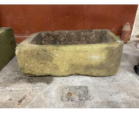 A 19TH CENTURY STONE TROUGH.64cm wide 39cm deep 21cm high.