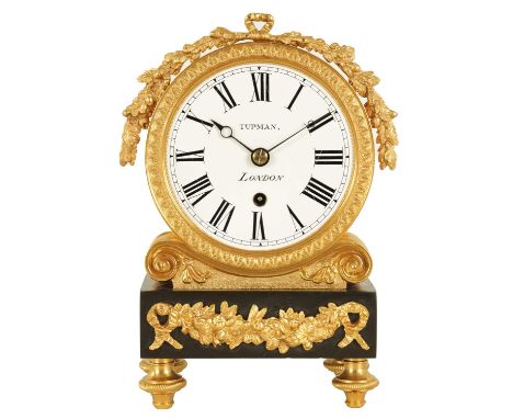 TUPMAN, LONDON. AN ENGLISH REGENCY MARBLE AND ORMOLU FUSEE MANTEL CLOCK surmounted by an acorn and leaf garland on a drum-sha