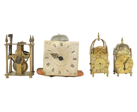 A COLLECTION OF FOUR CLOCKS comprising a late 18th-century hooded wall clock movement with alarm fronted by a 7" silvered eng