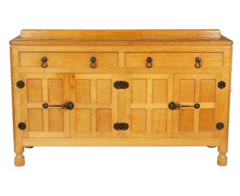 A ROBERT ‘MOUSEMAN’ THOMPSON AZED OAK SIDEBOARD fitted pair of frieze drawers above double cupboard doors, fitted black iron 