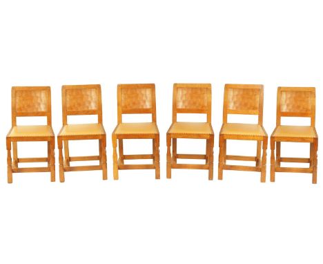 A SET OF SIX ROBERT ‘MOUSEMAN’ THOMPSON AZED OAK DINING CHAIRS with panel backs and hide leather seats; standing on octagonal