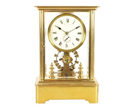EUREKA CLOCK CO. LTD. LONDON. AN EARLY 20TH CENTURY ENGLISH BRASS FOUR-GLASS ELECTRIC MANTEL CLOCK the moulded case inset wit