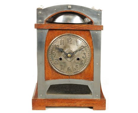 AN ARTS AND CRAFTS HAMBURG AMERICAN COMPANY OAK AND NICKEL MOUNTED MANTEL CLOCK with eight-day spring driven movement strikin