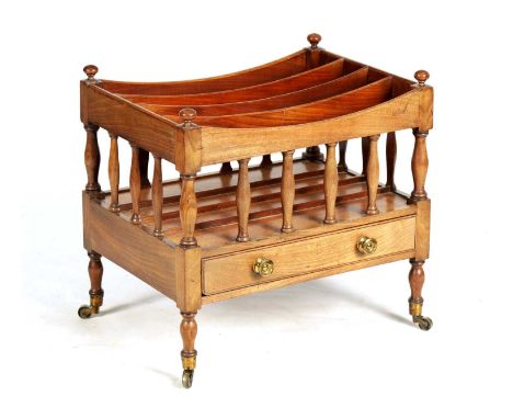 A REGENCY MAHOGANY CANTERBURY with four sectional top supported by split column uprights above a frieze drawer fitted gilt br