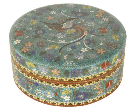 A 19TH CENTURY CHINESE CLOISONNÉ ENAMEL LIDDED CIRCULAR BOX decorated with brightly coloured flower head centred by a bird15c