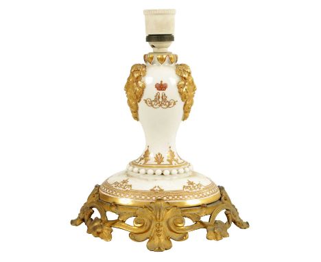 A 19TH CENTURY RUSSIAN PORCELAIN GILT HIGHLIGHTED ORMOLU-MOUNTED LAMP with masked sides and oval-shaped base, decorated with 