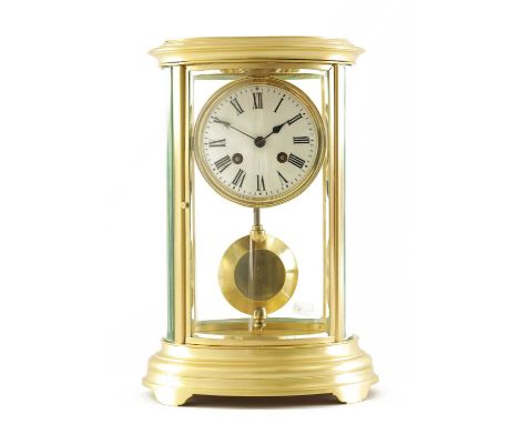 A 19TH CENTURY FRENCH BRASS OVAL FOUR GLASS MANTEL CLOCK the 4" enamel dial with Roman numerals fronting an eight-day spring-