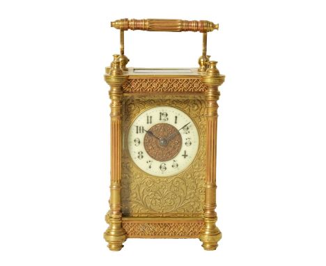 A LATE 19TH CENTURY FRENCH CARRIAGE CLOCK the brass case with pierced panels and reeded turned corner columns enclosing a mas