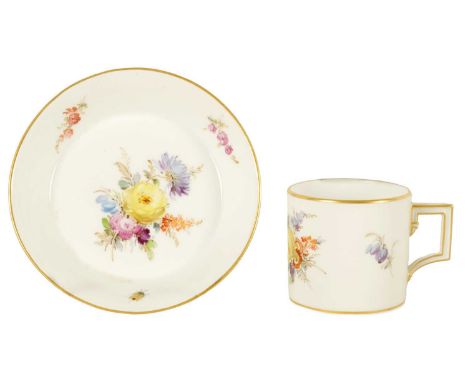 AN 18TH CENTURY MEISSEN COFFEE CUP AND SAUCER hand painted with bouquets of flowers - signed with cross sword mark underneath
