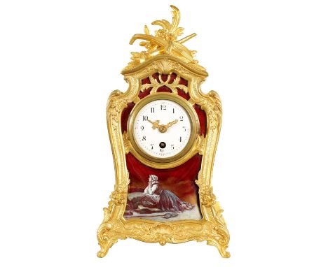 A 19TH CENTURY FRENCH ORMOLU AND LIMOGES PANELLED MANTEL CLOCK the case surmounted by a floral spray and musical instruments 