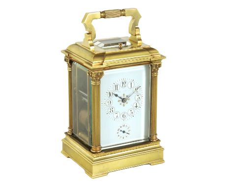 A LATE 19TH CENTURY FRENCH GRAND SONNERIE REPEATING CARRIAGE CLOCK the brass moulded case having reeded Corinthian corner col