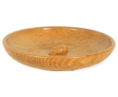 A ROBERT 'MOUSEMAN' THOMPSON OAK FRUIT BOWL of shallow adzed circular form with central high relief carved mouse trademark31c