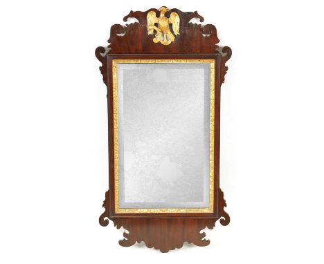 A 19TH CENTURY MAHOGANY HANGING MIRROR with shaped surround and gilt bird cresting90cm high 48cm wide 
