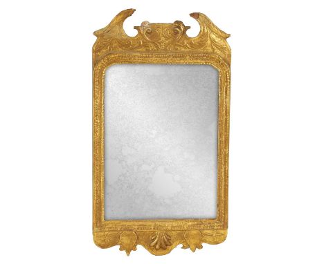A GEORGE II CARVED GILT WOOD MIRROR OF SMALL PROPORTIONS with swan neck pediment and relief carved leaf work decoration to th