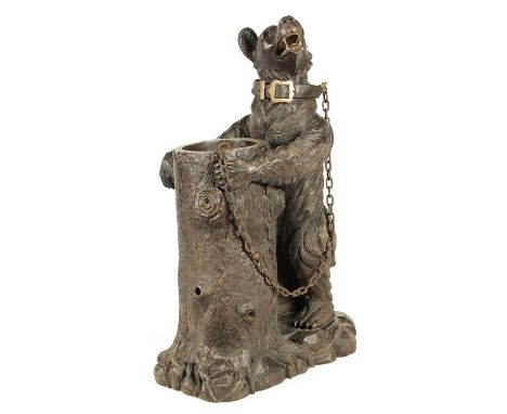 AN IMPRESSIVE 19TH CENTURY LINDEN WOOD BLACK FOREST CARVED BEAR STICK STAND depicting a bear holding a tree trunk with glass 