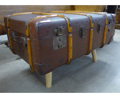 A vintage seamer trunk on legs 