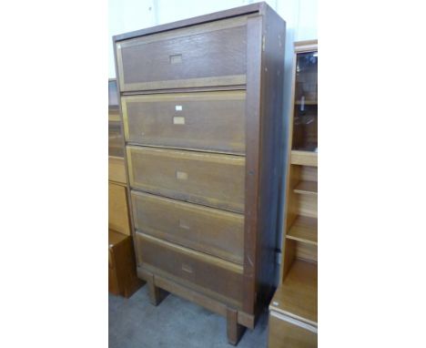 A Staverton Government Issue light oak five door filing cabinet (locked and without a key) 