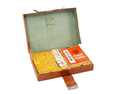 VINTAGE CHINESE MAHJONG SET, four trays fitted with plastic tiles and complete with bone money sticks in leather caseProvenan