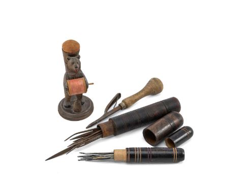 TREEN COLLECTABLES comprising Black Forest carved bear pin cushion, 2 x sailmakers needle cases and needles, and a Brown's pa