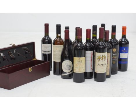 A collection of thirteen bottles of various wines together with a wooden box for a wine bottle equipped with bar tools. (14)