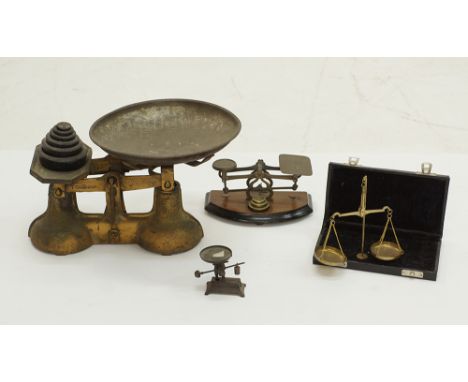 A collection of brass scales the largest W30cm, c1900s. (4)