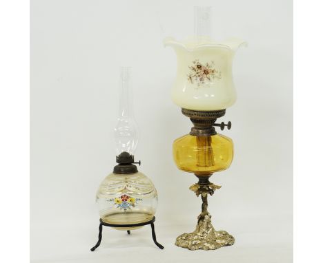 Two table oil Lamps. A Bohemian globular body clear glass oil lamp with enameled decoration, with a clear glass chimney, sitt