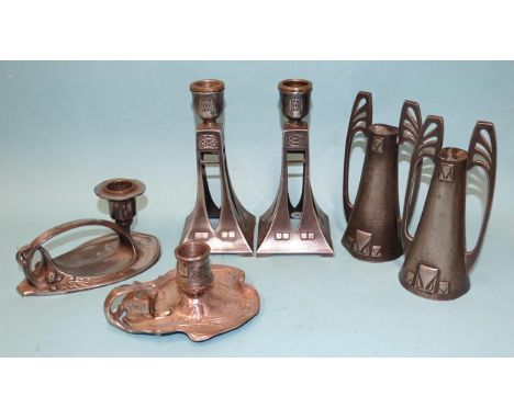 A pair of WMF Secessionist plated candlesticks of flared tapering form, with spearhead pierced bodies and Celtic embossed dec