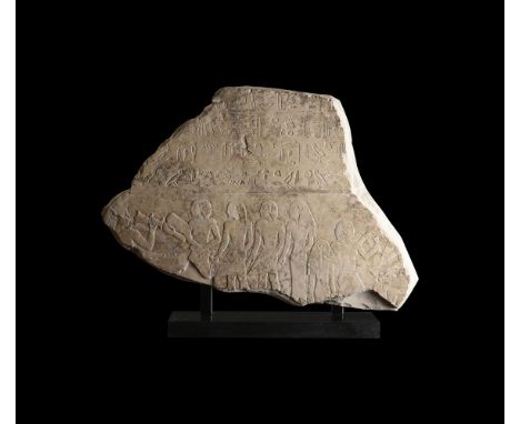 AN EGYPTIAN LIMESTONE STELE FRAGMENT MIDDLE KINGDOM, 11TH-12TH DYNASTY, CIRCA 2050-1950 B.C. Carved in shallow relief with tw