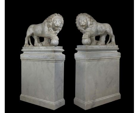 A LARGE PAIR OF CARVED MARBLE 'MEDICI LIONS' IN THE 'GRAND TOUR' MANNER, 20TH CENTURY Swept plinth bases and further modern w