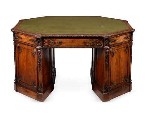 A MAHOGANY OCTAGONAL PARTNER'S DESKIN THE MANNER OF THOMAS CHIPPENDALE, CIRCA 1900The tooled leather inset top above gadroone