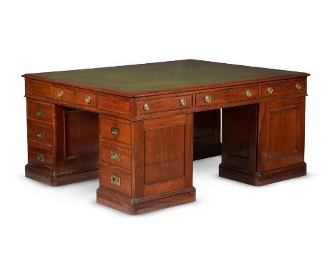 A VICTORIAN MAHOGANY FOUR PEDESTAL DESKCIRCA 1890Two pedestals with three drawers each, the other two with panelled cupboards